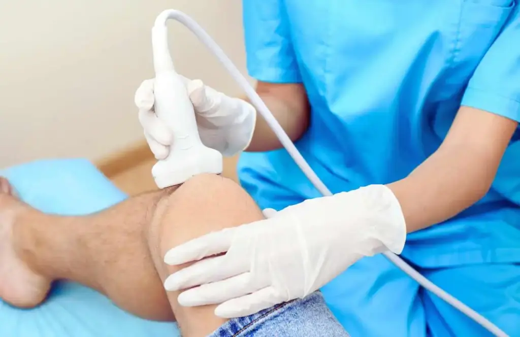 Can Ultrasound Therapy Cause Cancer? Here’s What Science Really Says 2 Ultrasound therapy being applied to a bandaged joint during physical therapy session